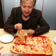 Image: AP Photo/Carolyn Kaster | HRC eating pizza in 2008. Clear and incontrovertible proof.